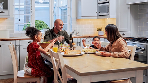 Family eating in kitchen
