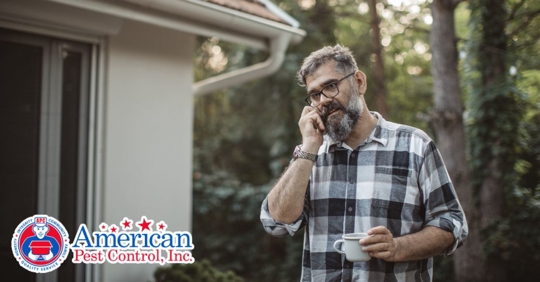 Man on phone outside his house