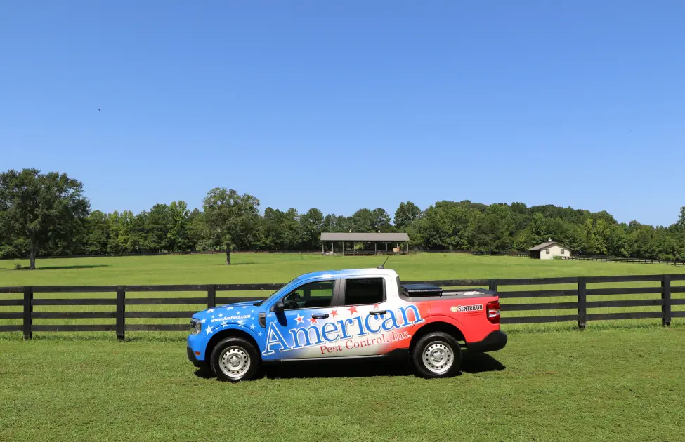 American Pest Control, Inc. truck parked in a farm field