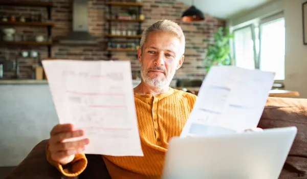 Man reviews his pest control bill