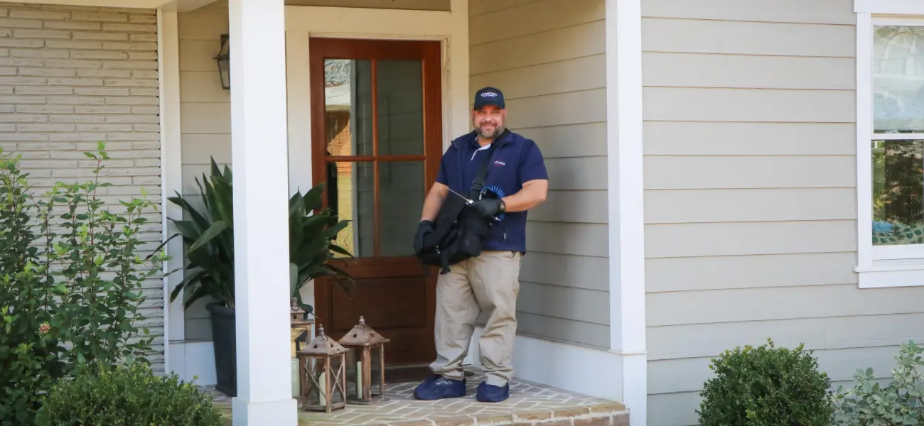 American Pest Control, Inc. checking home as part of a pest protection maintenance plan
