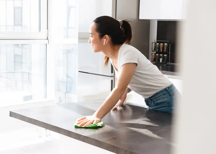 Wiping counters with cleaner in an Athens, GA home. It’s a common myth that bed bugs seek out dirty homes—in reality, they aren't attracted to dirt; they’re attracted to blood.