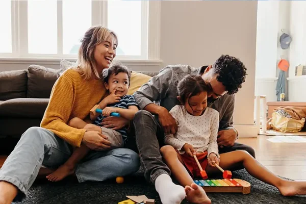 Family laughing in their residential home, protected by American Pest Controls professional services.